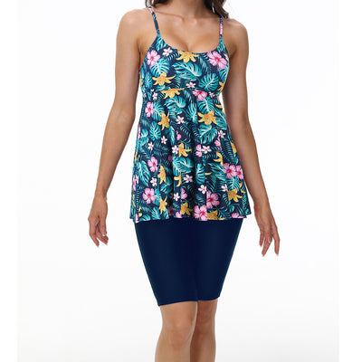 Women's navy blue two-piece swimsuit with white floral tankini top and matching solid swim shorts. - Image 21