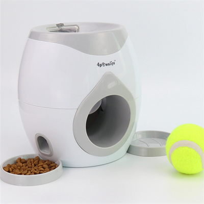 White and grey automatic tennis ball launcher for dogs, dispensing food, with a tennis ball and kibble bowl. - Image 6