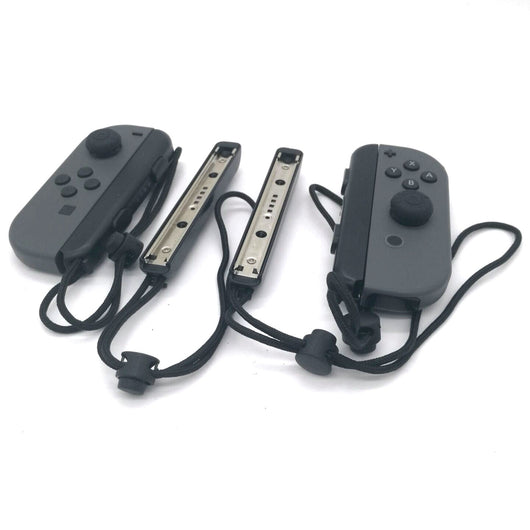 Two black Nintendo Switch Joy-Con wrist straps, one showing internal metal rail, the other with buttons and lanyard. - Image 4