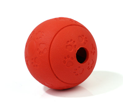 Red TPR dog leaking food ball with paw print patterns and a treat dispensing hole. - Image 6