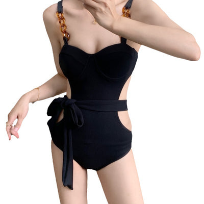 Black ribbed one-piece swimsuit with sweetheart neckline, chain-link shoulder strap, side cut-outs, and self-tie waist. - Image 5