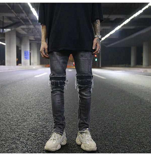 Jeans ajustados con rotos diseñados