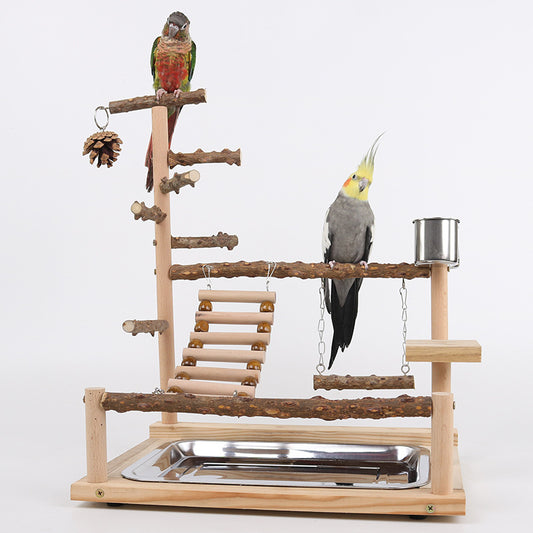 Multi-level natural wood parrot play stand with perches, ladder, swings, and two stainless steel feeding cups.