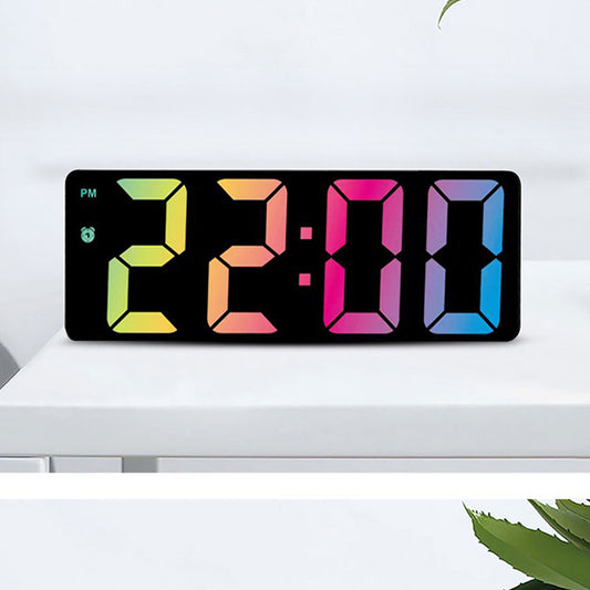 Modern rectangular digital alarm clock with a mirrored face and large, colorful LED numbers displaying the time.