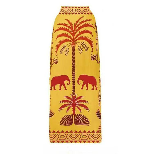 Black one-piece swimsuit with an asymmetrical top and matching long skirt, featuring a tropical palm tree and bird print. - Image 17
