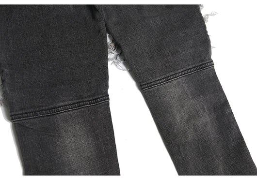 Jeans ajustados con rotos diseñados - Image 10