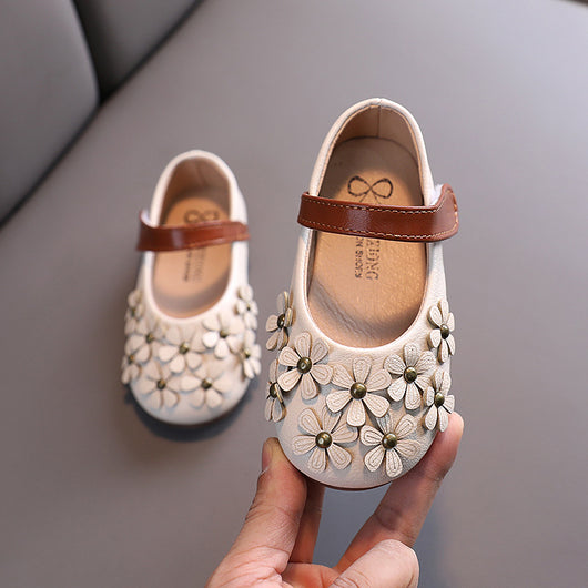 Black Mary Jane shoes for girls with 3D flower appliques on the toe and a brown hook-and-loop strap. - Image 4