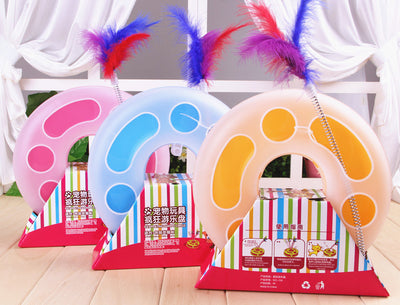 Interactive cat toy with a yellow and white circular ball track base and a spring-mounted feather wand. - Image 2