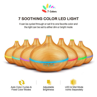 Wood grain ultrasonic aromatherapy diffuser and humidifier with a glowing blue LED light band and control buttons. - Image 3