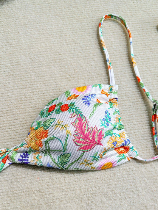 White ribbed two-piece bikini with colorful floral print, featuring a bandeau top and high-cut bottom. - Image 25