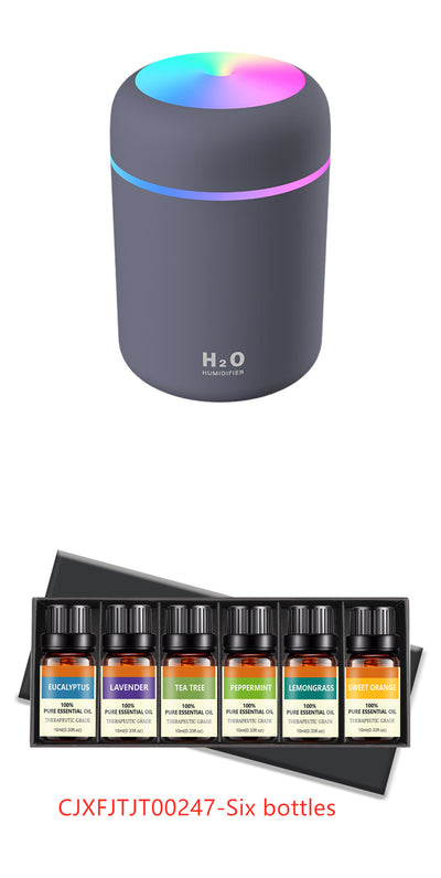 Pink ultrasonic aromatherapy essential oil diffuser with a colorful LED light band and top light, labeled H2O Humidifier. - Image 7