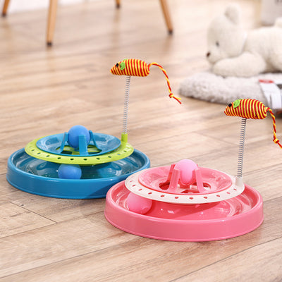 Pink two-tier cat play plate with a rolling ball track and a spring-mounted striped mouse toy.
