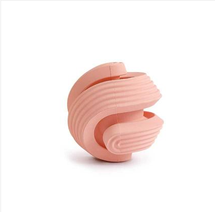 Pink rubber dog molar teeth relief bouncy ball being rinsed with water, showing its textured surface. - Image 4