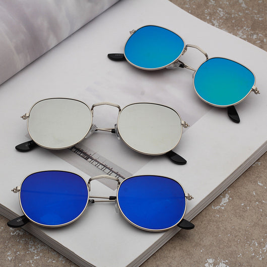 Round metallic sunglasses with iridescent green and gold lenses and a gold-colored metal frame. - Image 3