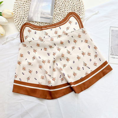 Female cream and black floral polka dot sun protection mask with ear loops, designed for eye corner protection. - Image 16