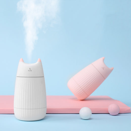 Pink cat-shaped humidifier with pointed ears and a ribbed texture on the lower body, ideal for desktop use. - Image 3