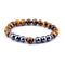 Pulsera Elástica Ojo de Tigre Amarillo con Separador de Obsidiana