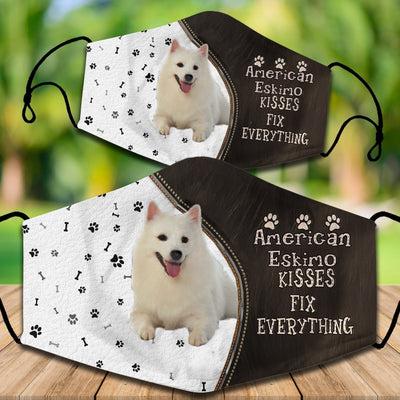 Two cotton face masks with a Bichon Frise dog, paw prints, and bones on a white and brown background. Text reads "Bichon Frise KISSES FIX EVERYTHING." - Image 13