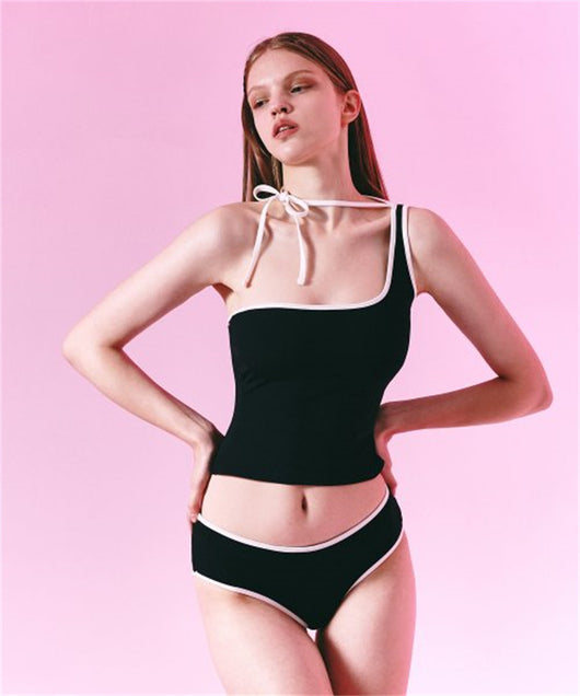 Women's light purple one-shoulder swimsuit with dark red contrast trim, lying on a striped blanket on green grass. - Image 16