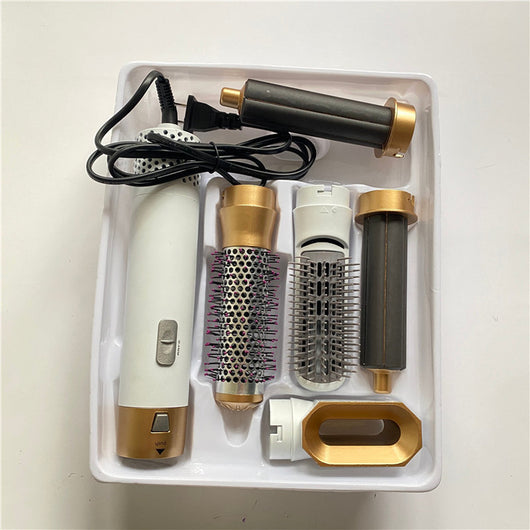 5-in-1 hot air comb hair dryer set with multiple rose red and gray attachments in a white tray. - Image 18