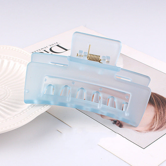 Frosted light blue rectangular hair claw clip with a gold-toned spring mechanism, ideal for securing hair. - Image 9