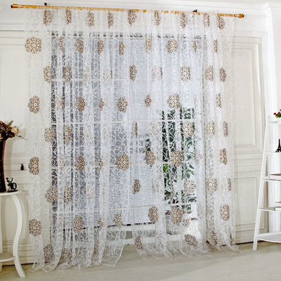 Sheer white European-style floral curtain with brown and gold patterns, hung on a gold rod in a bedroom. - Image 8