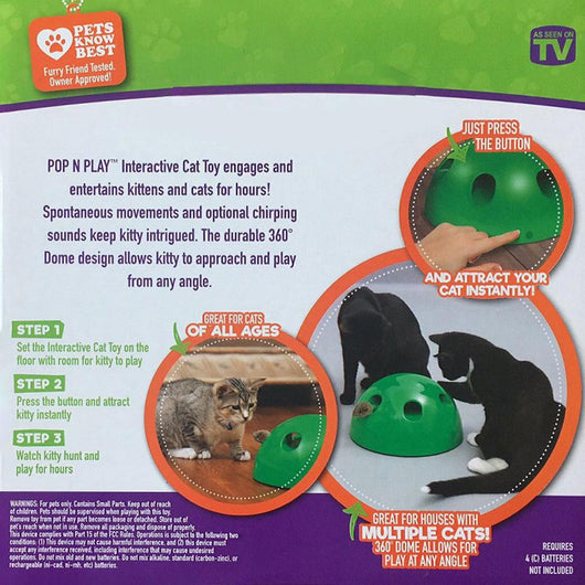 A cute tabby and white kitten with green eyes playing with a bright green dome-shaped interactive cat toy. - Image 7