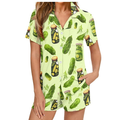 White short-sleeve pajama set with red and green Christmas tree and star print, featuring green piping. - Image 13