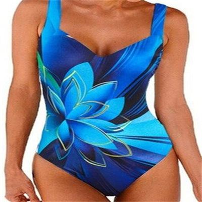 Blue one-piece swimsuit with a large light blue lotus floral print outlined in gold, featuring a V-neck and wide straps. - Image 7