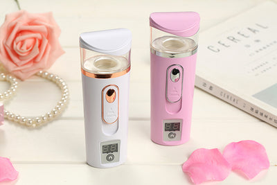 White and rose gold nano spray water meter with a clear tank, digital display, and power button. - Image 6