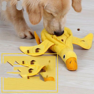 Golden retriever puppy biting a yellow plush duck dog toy with an orange beak and black eyes. - Image 2