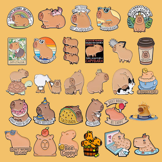 Cute capybara enamel brooch wearing a pink donut with sprinkles and "DONUT WORRY BE CAPPY" text. - Image 36