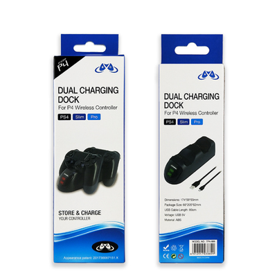 Black dual charging dock for PS4 wireless controllers with green LED indicators, shown with its retail box and USB cable. - Image 5