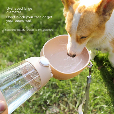 Yellow portable pet water bottle with clear reservoir, built-in drinking bowl, and wrist strap, 28cm tall. - Image 5