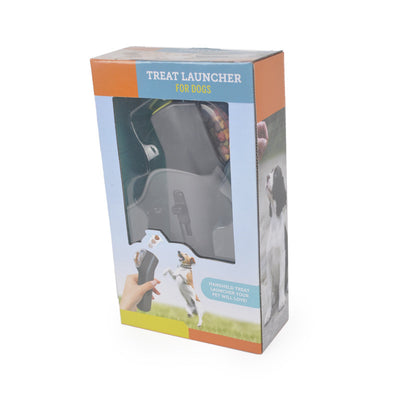 Dog Treat Launcher in retail packaging, a gray handheld device for dispensing snacks during training or playtime. - Image 8