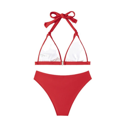 Red lace-up halterneck bikini modeled by a woman against a blue ocean and distant coastline. - Image 5