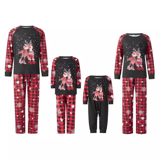 Family matching Christmas pajamas with black long-sleeve tops featuring reindeer and red plaid pants with snowflakes. - Image 2