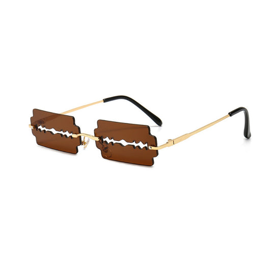 Orange razor blade shaped rimless sunglasses with gold metal frames and black ear tips on a white background. - Image 7