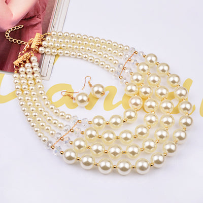 Multi-strand faux pearl and crystal necklace with matching drop earrings on a black jewelry bust. - Image 3