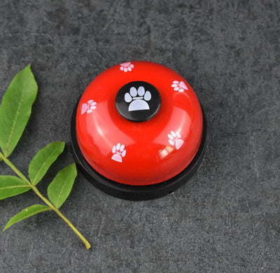 Blue and yellow pet training bell with white paw print designs and a large yellow button on top. - Image 8