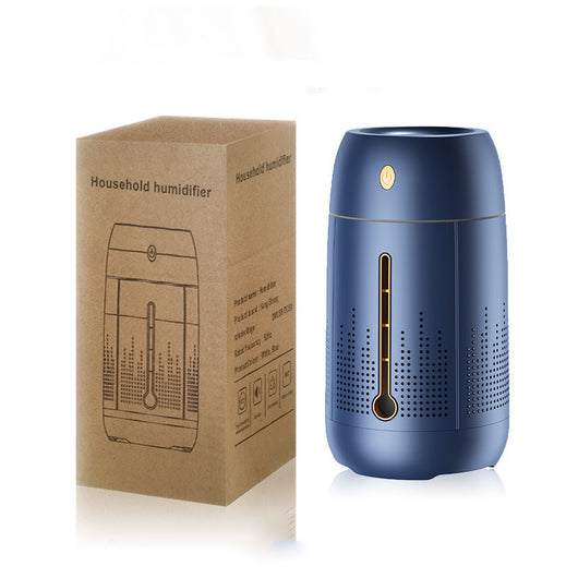 White cylindrical household humidifier with a visible water level indicator, next to its brown cardboard packaging. - Image 6