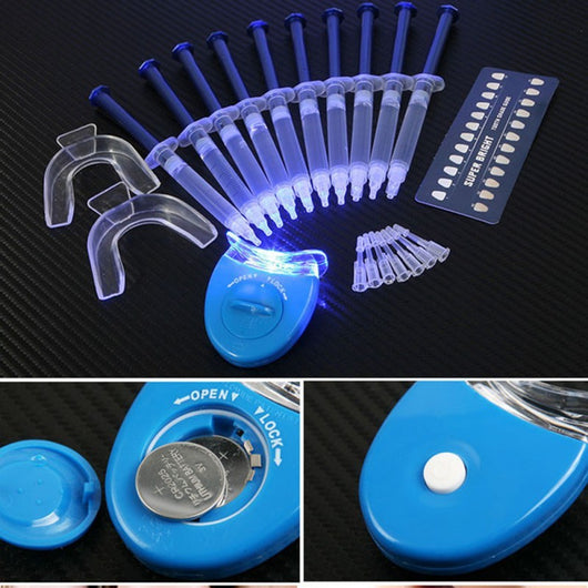 Teeth whitening kit with a blue LED light mouthpiece and a syringe of whitening gel on a white background.
