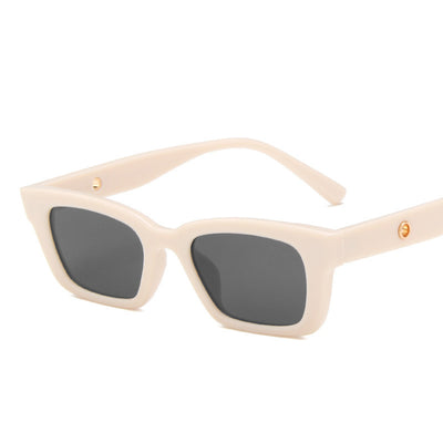 Transparent gray frame sunglasses with dark gray rectangular lenses and small gold accents on the temples. - Image 7