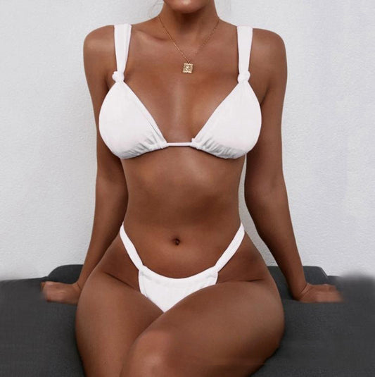 Light blue two-piece bikini with a halter triangle top and knotted straps. Features a thong-style bottom with side ruching.