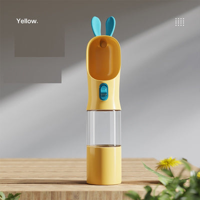 Grey and white portable pet water bottle with clear reservoir, built-in drinking bowl, and decorative bunny ears. - Image 14