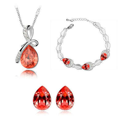 Pink teardrop crystal jewelry set with silver-tone necklace, bracelet, and stud earrings, accented with clear stones. - Image 9