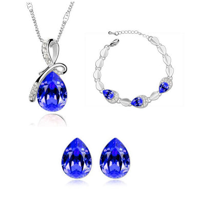 Pink teardrop crystal jewelry set with silver-tone necklace, bracelet, and stud earrings, accented with clear stones. - Image 11