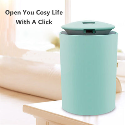 White cylindrical USB mini humidifier with blue LED light, emitting a fine mist, suitable for home or car. - Image 4