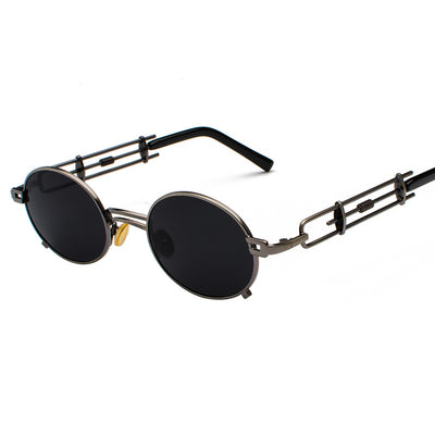 Black individual steampunk sunglasses with round clear lenses and unique metal frames on a white background. - Image 9
