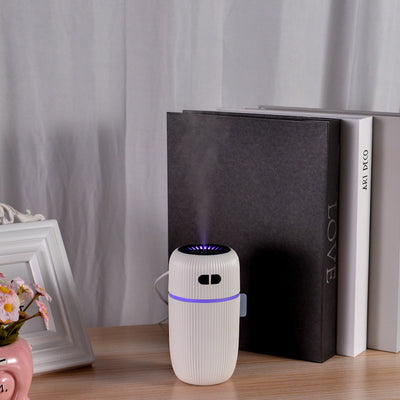Black ribbed white noise humidifier with control buttons on top, designed to aid sleep and humidify. - Image 10